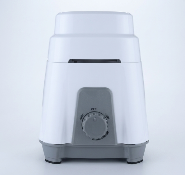 A clean, front-facing studio photograph of a modern electric mixer grinder base presented against a solid, light-grey background. The appliance features a glossy white tiered polymer upper body resting on a smooth grey molded base equipped with non-slip rubber feet.